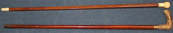 A 19th ivory handled square section walking cane & another